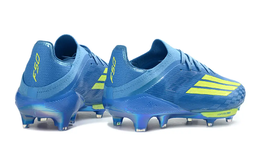 Detail of Adidas F50+ Elite FG football shoe, featuring the iconic Adidas three-stripe design and premium materials.