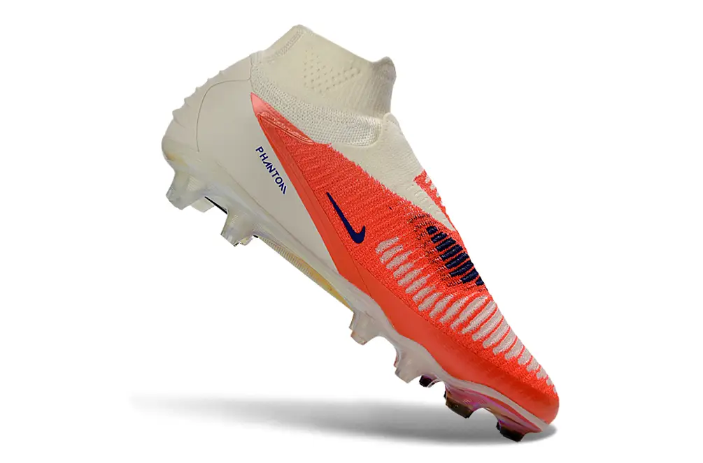 Nike Phantom 6 DF Elite Football Cleats in a dynamic pose, showcasing agility and speed on the field