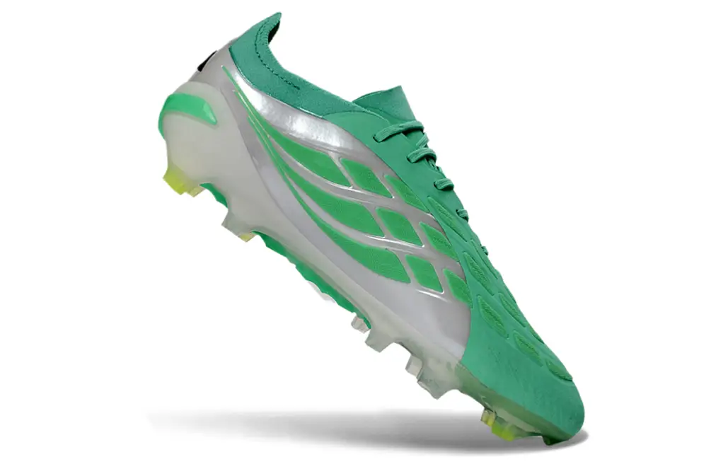 Player wearing Adidas Predator 26 Elite FG football cleat in action on the field.