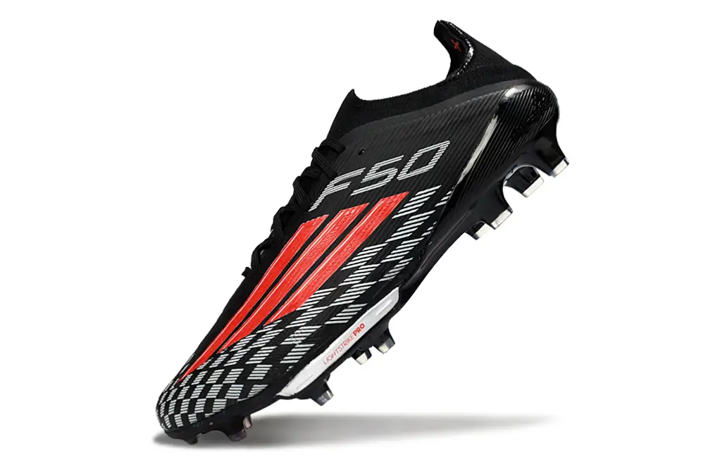 Close-up of Adidas F50+ Elite FG football boot laces and studs