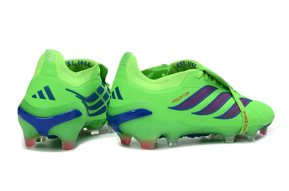 Professional footballer wearing Adidas Predator 26 Elite Tongue FG soccer cleats in a game setting
