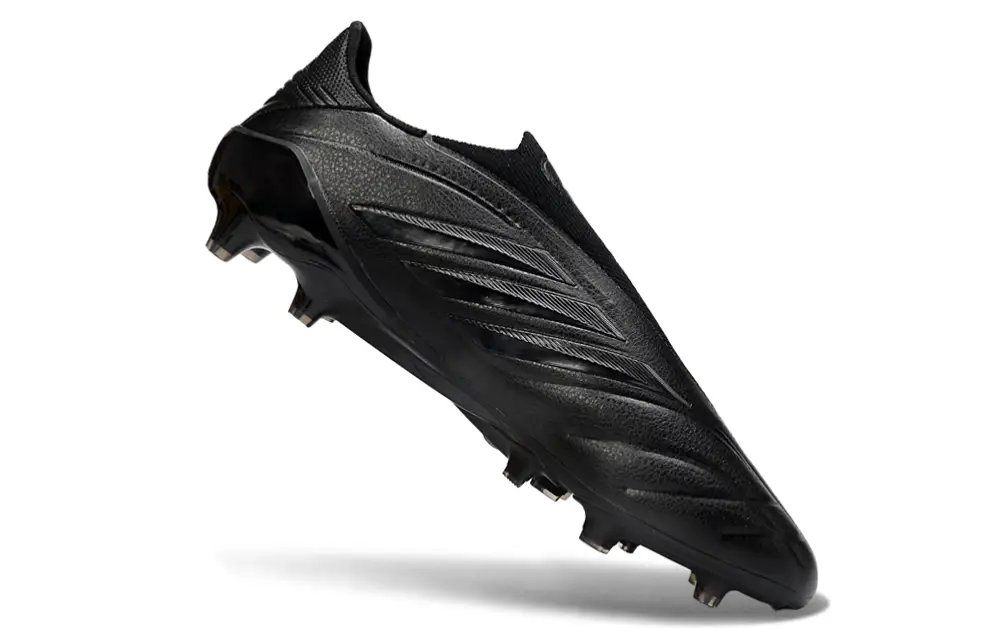 Adidas Copa Pure IV Elite Laceless FG football cleat in action on the field