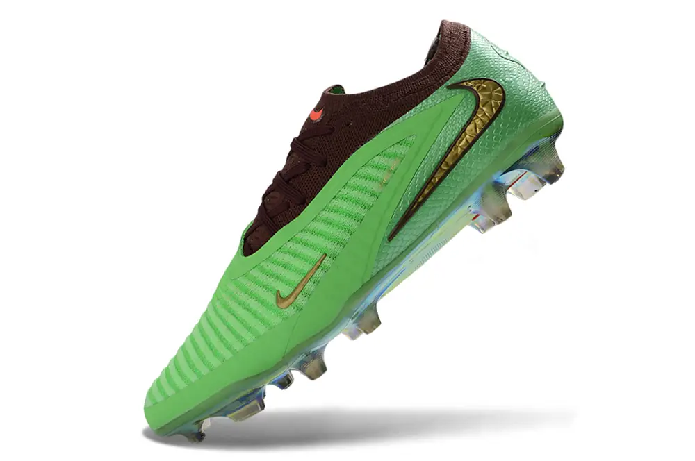 Side profile of Nike Phantom 6 Elite FG Travis Scott edition showcasing textured upper and firm ground soleplate